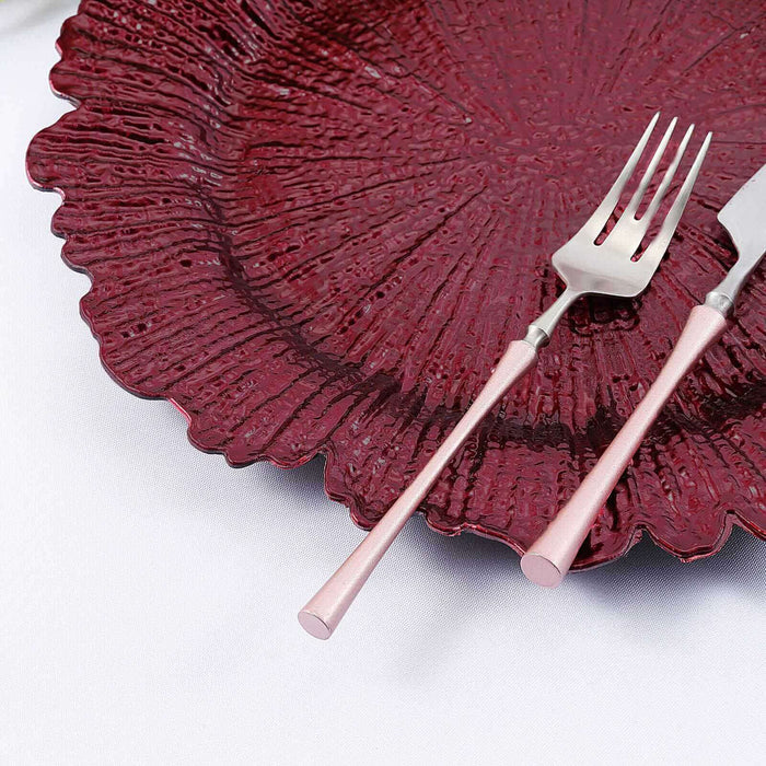 Elegant burgundy plate with matching fork and knife, perfect for dining.