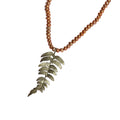 Necklace with leaf pendant and pearl beads