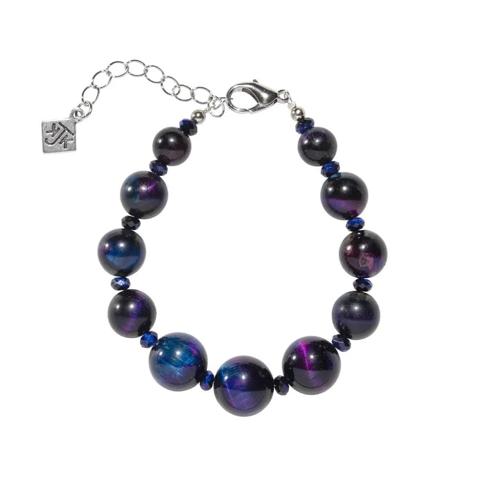 Bracelet with purple beads and silver clasp on a white background