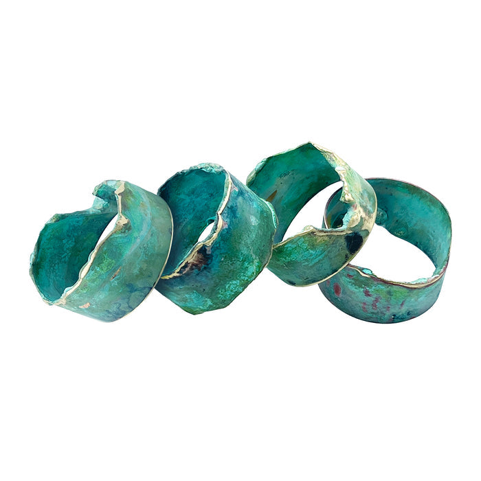 Napkin rings with patina on a white background