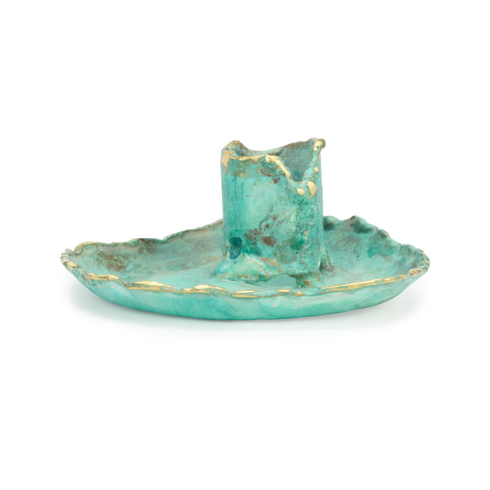 Turquoise ceramic candle holder with gold accents on a white background
